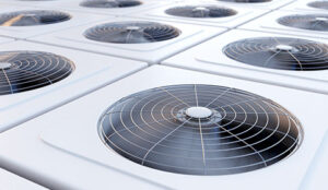 Close up of multiple ac units with fans on top